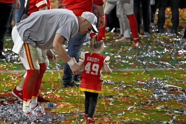 Daniel Sorensen of the Kansas City Chiefs celebrates with his daughter after defeating the San Francisco 49ers 31-20 in Super Bowl LIV at Hard Rock Stadium on February 2, 2020 in Miami. (Ronald Martinez/Getty Images)