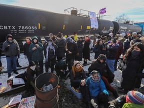 Supporters of the indigenous Wet'suwet'en Nation occupy railway tracks as part of a protest against British Columbia's Coastal GasLink pipeline, in Toronto, Ontario, Canada February 15, 2020.