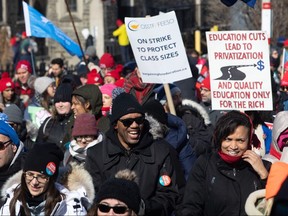 Protesters join a demonstration organized by the Teacher's Unions outside the Ontario Legislature, in Toronto, as four Teacher's Unions hold a province-wide education strike on Friday, Feb. 21, 2020. (THE CANADIAN PRESS/Chris Young)