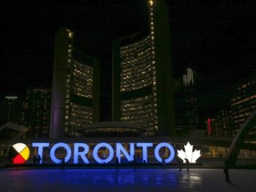 The Toronto sign at Nathan Phillips Square is illuminated in blue to mark the 185th anniversary of the City of Toronto,