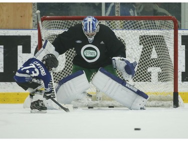 Kyle Clifford's son Brody play some one-on-one with Toronto Maple Leafs goalie Jack Campbell at the end of practice  in Toronto on Wednesday February 19, 2020. Jack Boland/Toronto Sun/Postmedia Network