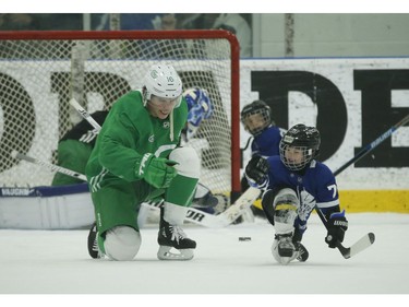 Toronto Maple Leafs Mitch Marner teaches Kyle Clifford's son Brody the fist pump celebration after Brody beat goalie Jack Campbell during a little one-on-one play at the end of practice  in Toronto on Wednesday February 19, 2020. Jack Boland/Toronto Sun/Postmedia Network