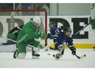 Toronto Maple Leafs Mitch Marner teaches Kyle Clifford's son Brody the fist pump celebration after Brody beat goalie Jack Campbell during a little one-on-one play at the end of practice  in Toronto on Wednesday February 19, 2020. Jack Boland/Toronto Sun/Postmedia Network