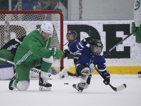 Maple Leafs Mitch Marner teaches Kyle Clifford's son Brody the fist pump celebration after Brody beat goalie Jack Campbell during a little one-on-one play at the end of practice  in Toronto on Wednesday.Jack Boland/Toronto Sun/Postmedia Network