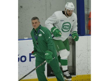 Toronto Maple Leafs coach Sheldon Keefe hits the ice ahead of Kyle Clifford (73) during practice in Toronto on Wednesday February 19, 2020. Jack Boland/Toronto Sun/Postmedia Network