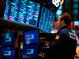 Traders work during the opening bell at the New York Stock Exchange (NYSE) on Feb. 27, 2020 at Wall St. in New York City.