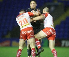 Toronto Wolfpack’s Sonny Bill gets tackled by two St. Helens players yesterday. Steve Gaunt photo
