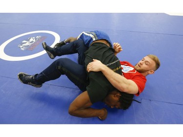 Clayton Pye (red T-shirt), a wrestler at Brock University, gets in some training with one of his teammates Iggy Pitt. Pye has overcome adversity after almost being fatally stabbed a few years ago, is well on his way to competing for Canada at the Olympics.  in Toronto, Ont. on Tuesday February 18, 2020. Jack Boland/Toronto Sun/Postmedia Network