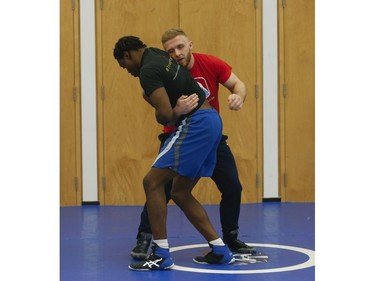 Clayton Pye (red T-shirt), a wrestler at Brock University, gets in some training with one of his teammates Iggy Pitt. Pye has overcome adversity after almost being fatally stabbed a few years ago, is well on his way to competing for Canada at the Olympics.  in Toronto, Ont. on Tuesday February 18, 2020. Jack Boland/Toronto Sun/Postmedia Network