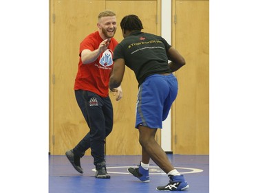 Clayton Pye (red T-shirt), a wrestler at Brock University, gets in some training with one of his teammates Iggy Pitt. Pye has overcome adversity after almost being fatally stabbed a few years ago, is well on his way to competing for Canada at the Olympics.  in Toronto, Ont. on Tuesday February 18, 2020. Jack Boland/Toronto Sun/Postmedia Network