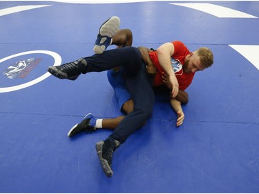 Clayton Pye (red T-shirt), a wrestler at Brock University, gets in some training with one of his teammates Iggy Pitt. Pye has overcome adversity after almost being fatally stabbed a few years ago, is well on his way to competing for Canada at the Olympics.  in Toronto, Ont. on Tuesday February 18, 2020. Jack Boland/Toronto Sun/Postmedia Network