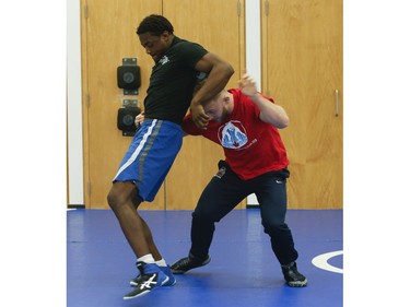 Clayton Pye (red T-shirt), a wrestler at Brock University, gets in some training with one of his teammates Iggy Pitt. Pye has overcome adversity after almost being fatally stabbed a few years ago, is well on his way to competing for Canada at the Olympics.  in Toronto, Ont. on Tuesday February 18, 2020. Jack Boland/Toronto Sun/Postmedia Network