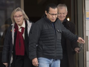 Wet'suwet'en hereditary leader Chief Woos, also known as Frank Alec, centre, Minister of Crown-Indigenous Relation, Carolyn Bennett, left, and B.C. Indigenous Relations Minister Scott Fraser arrive to address the media in Smithers, B.C.. on Sunday.