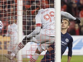 Toronto FC forward Ifunanyachi Achara heads in his team's game-winning goal against New York City FC on Saturday. (THE CANADIAN PRESS)