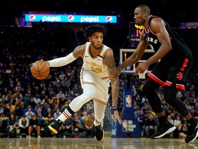 Golden State Warriors forward Marquese Chriss drives the ball against Toronto Raptors' Serge Ibaka on Thursday night. (USA TODAY SPORTS)