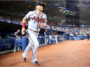 Josh Donaldson #20 of the Atlanta Braves takes the field to warm up prior to the first inning of an MLB game against the Toronto Blue Jays at Rogers Centre on August 27, 2019 in Toronto, Canada.
