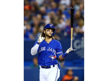 Bo Bichette #11 of the Toronto Blue Jays reacts after taking a strike in the first inning during a MLB game against the Houston Astros at Rogers Centre on September 1, 2019 in Toronto, Canada.