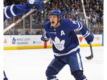 Mitchell Marner #16 of the Toronto Maple Leafs celebrates his overtime game winning goal against the Boston Bruins during an NHL game at Scotiabank Arena on October 19, 2019 in Toronto, Ontario, Canada.
