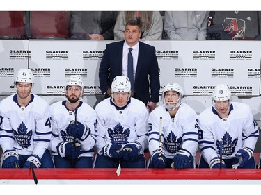 Head coach Sheldon Keefe of the Toronto Maple Leafs looks up from the bench during the first period of the NHL game against the Arizona Coyotes at Gila River Arena on November 21, 2019 in Glendale, Arizona.