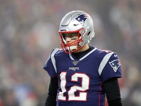 Tom Brady of the New England Patriots looks on during the first half against the Tennessee Titans in the AFC Wild Card Playoff game at Gillette Stadium on January 04, 2020 in Foxborough, Massachusetts.