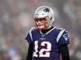 Tom Brady of the New England Patriots looks on during the first half against the Tennessee Titans in the AFC Wild Card Playoff game at Gillette Stadium on January 04, 2020 in Foxborough, Massachusetts.