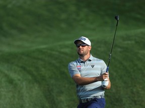 Corey Conners of Canada plays a shot on the fourth hole during the first round of The PLAYERS Championship on The Stadium Course at TPC Sawgrass on March 12, 2020 in Ponte Vedra Beach, Florida.