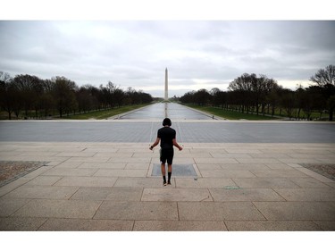 Zef Talahun jumps the rope on the plaza in front of the Lincoln Memorial, normally filled with tourists, but now nearly empty due to the impacts of coronavirus (COVID-19) on March 17, 2020 in Washington, DC.
