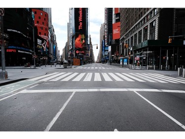 Times Square stands mostly empty as  as much of the city is void of cars and pedestrians over fears of spreading the coronavirus on March 22, 2020 in New York City.