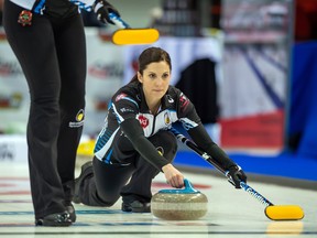 Team Homan lead Lisa Weagle throws a stone earlier this year. (POSTMEDIA NETWORK)