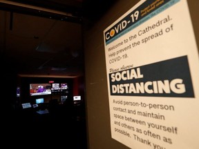 A sign advices about social distancing outside the control room as Archbishop of Los Angeles Jose H. Gomez celebrates Sunday mass via livestream at the Cathedral of Our Lady of the Angels. (Reuters)