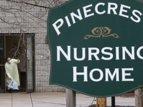 A staff member from the Pinecrest Nursing Home in Bobcaygeon , thanks a community member for delivering needed supplies on March 30, 2020. (Stan Behal, Toronto Sun)