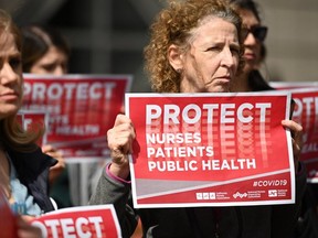 Nurses protest outside the UCLA Medical Center in Los Angeles on March 11, 2020 to oppose what they call the Center for Disease Control's (CDC) weak response to the novel coronavirus. (AFP via Getty Images)