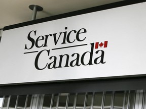 The sign at the closed Service Canada at Gerrard Square on  March 25, 2020. (Veronica Henri, Toronto Sun)