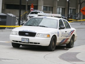 Toronto Police investigate a fatal shooting on March 22, 2020, in the Yonge-Gould Sts. area. (Veronica Henri, Toronto Sun)