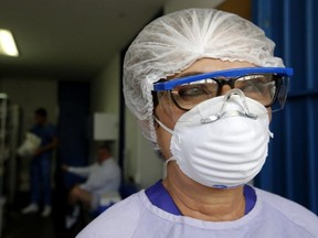 A medical worker wears protective gear to attend a suspected Covid-19 patient at the Hospital General de Occidente "Zoquipan" in Zapopan, Jalisco state, Mexico on March 25, 2020. (AFP via Getty Images)