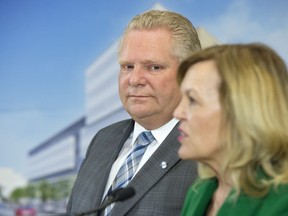 Ontario Premier Doug Ford watches as Health Minister Christine Elliott speaks at an event at The Centre for Addiction and Mental Health in Toronto on January 30, 2019.  THE CANADIAN PRESS/Frank Gunn
