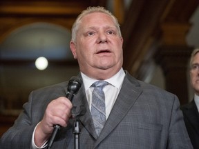 Ontario Premier Doug Ford answers questions following a meeting of all party leaders and health experts at the legislature in Toronto on March 11, 2020. THE CANADIAN PRESS/Frank Gunn