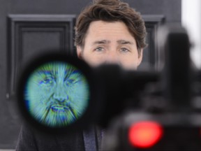 Prime Minister Justin Trudeau is seen through the viewfinder of a TV camera as he addresses Canadians on the COVID-19 situation from Rideau Cottage in Ottawa on Tuesday, March 24, 2020. THE CANADIAN PRESS/Sean Kilpatrick