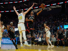 Toronto Raptors guard Norman Powell (24) shoots past Golden State Warriors forward Dragan Bender (10) during the second quarter at Chase Center. Stan Szeto-USA TODAY Sports