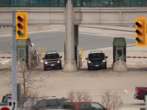 Cars stop at a Canadian Customs booth in Niagara Falls, Ontario, on March 18, 2020, hours after Prime Minister Justin Trudeau announced the closing of the border with the US to all tourists.