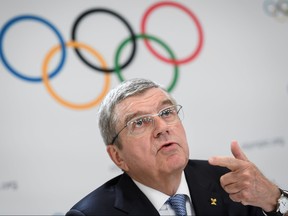 In this file photo taken on Jan. 11, 2020, International Olympic Committee (IOC) president Thomas Bach attends a press conference closing an Olympic session in Lausanne. (FABRICE COFFRINI/AFP via Getty Images)