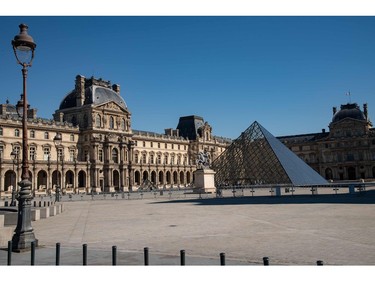 A picture taken on March 23, 2020, in Paris, shows the Louvre pyramid designed by Ieoh Ming Pei, on the seven day of a strict lockdown in France aimed at curbing the spread of COVID-19 caused by the novel coronavirus.