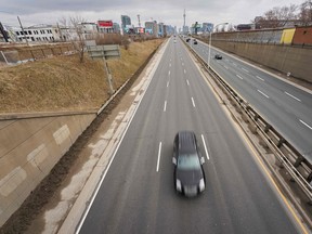 Only a few vehicles drive along the Gardner Expressway near downtown Toronto, Ontario on Tuesday.