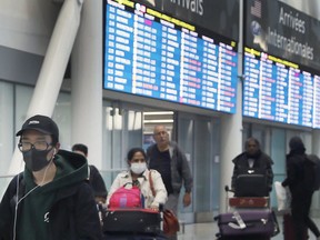 Passengers arrive at Pearson International Airport on Wednesday, March 4, 2020. (Veronica Henri/Toronto Sun/Postmedia Network)
