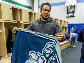 Running back Declan Cross, holding an Argos flag during a locker cleanout following their final game of the season, could remain in Double Blue through the end of the 2023 CFL campaign.                                               Ernest Doroszuk/Toronto Sun