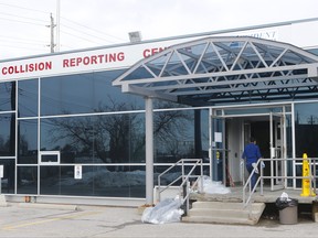Workers repaired the smashed glass doors and cleaned up smoke damage after an arson fire at a Collision Reporting Centre on Howden Ave. on Wednesday, March 4, 2020. A similar attempt was unsuccessful at a Collision Reporting Centre in North York. (Chris Doucette/Toronto Sun/Postmedia Network)