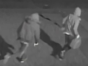 Investigators need help identifying two men who set fire to the East Collision Reporting Centre on Howden Rd., in Scarborough, on Wednesday, March 4, 2020. (Toronto Police handout)