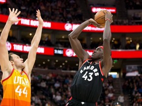 Toronto Raptors forward Pascal Siakam shoots the ball against Utah Jazz forward Bojan Bogdanovic during the first quarter at Vivint Smart Home Arena.