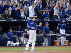 Toronto Blue Jays Jose Bautista flips his bat after hitting a three-run homer during the seventh inning in Game 5 of the ALDS in October 2015. The Canadian Press