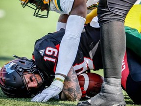 Argos’ new defensive lineman Alex Bazzie (top) comes to Toronto after six seasons with B.C. and Edmonton. (Al Charest/Postmedia)